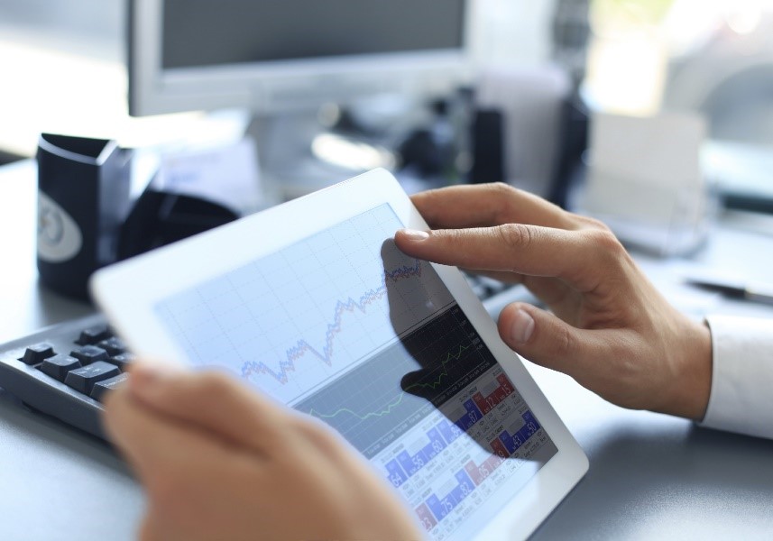 a man looking at tablet analysing data from his data