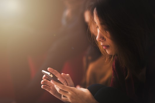 woman searching how to recycle her phone